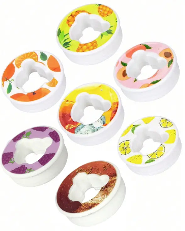 Set of colorful fruit-themed water flavor pods on a white background