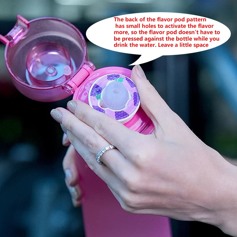 Pink water bottle with a flavor pod mechanism held by a hand, with text explaining its use.